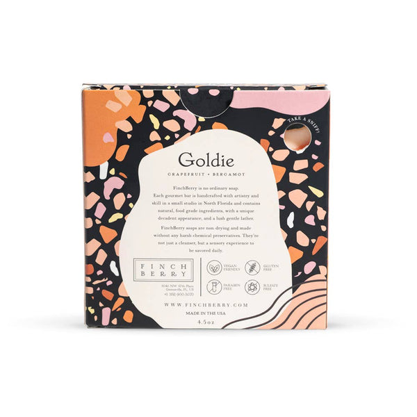 Goldie soap packaging with colorful design on a white background