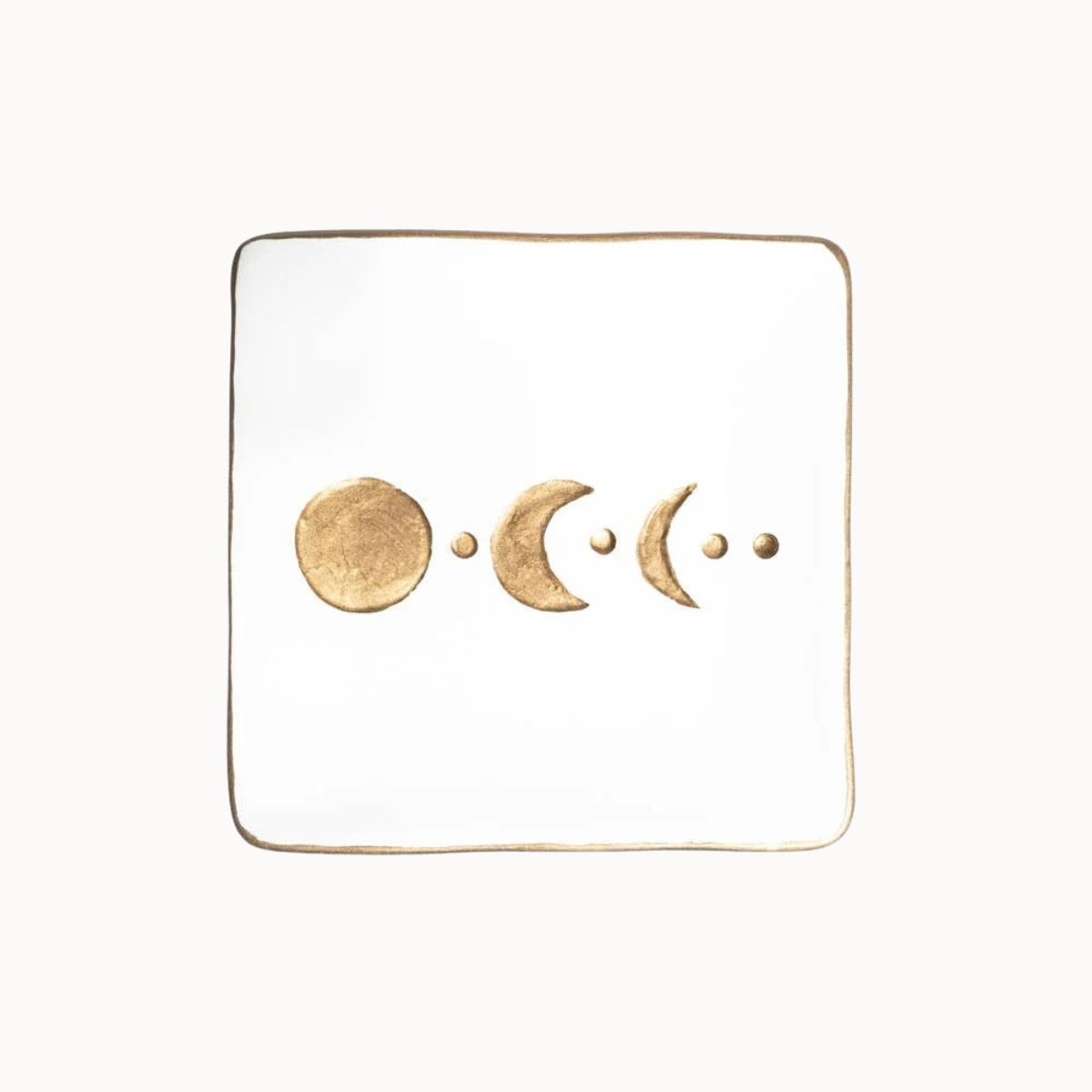 A square white tray with a thin gold border, featuring a gold foil moon phase design across the center.