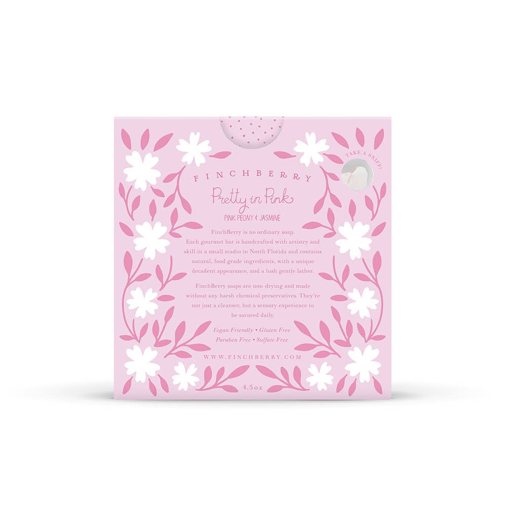 Pink packaging with floral designs and text on a white background