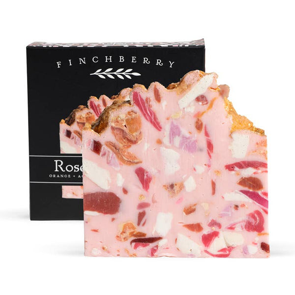 Bar of Finchberry soap with visible ingredients on a white background
