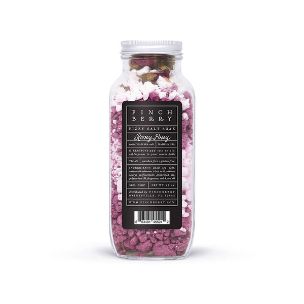Jar of pink bath salts with a label on a white background