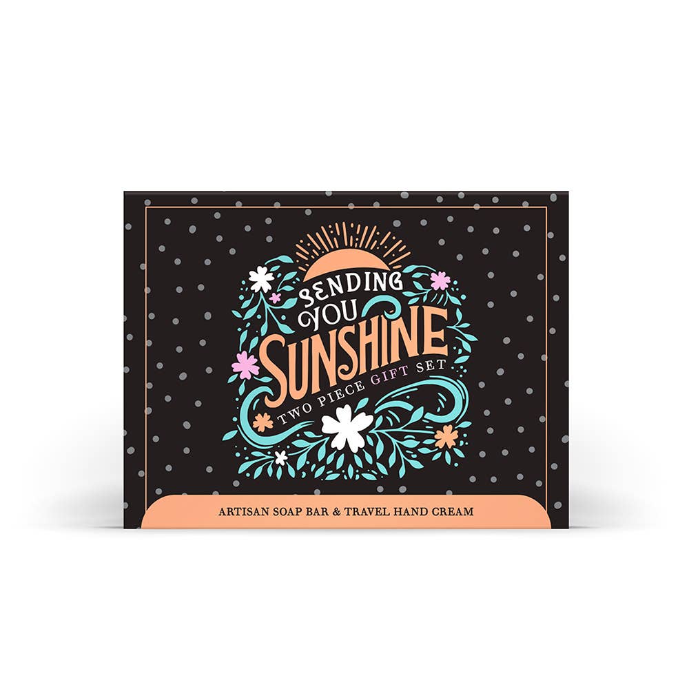 Gift set packaging with 'Sending You Sunshine' text and decorative elements on a black background.