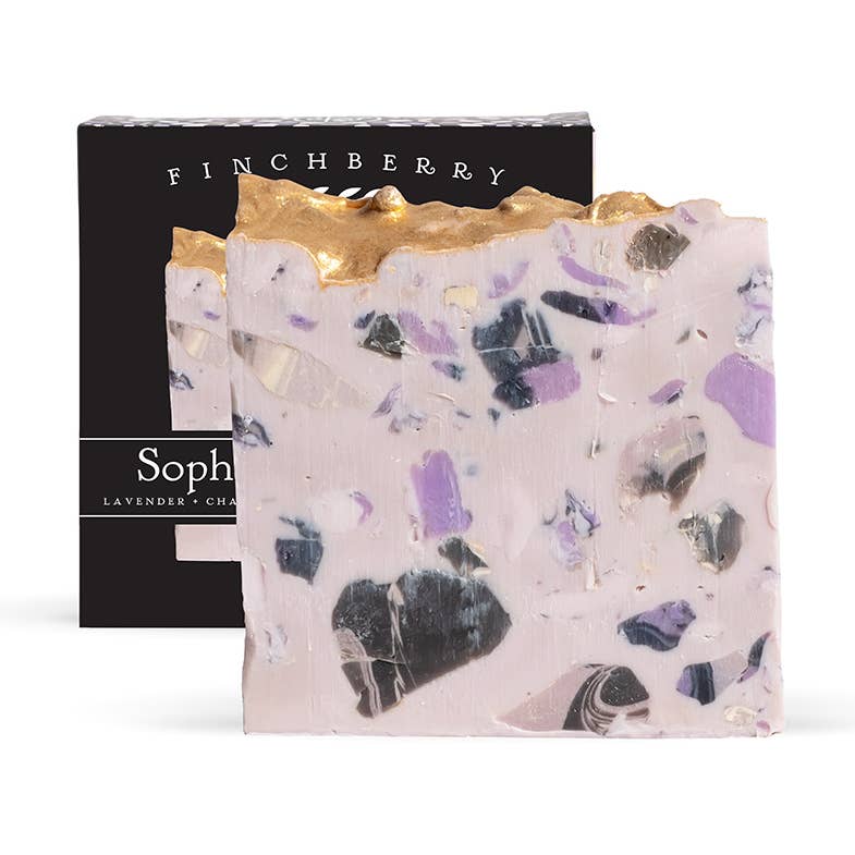 Finchberry soap bar with gold top and black box in the background