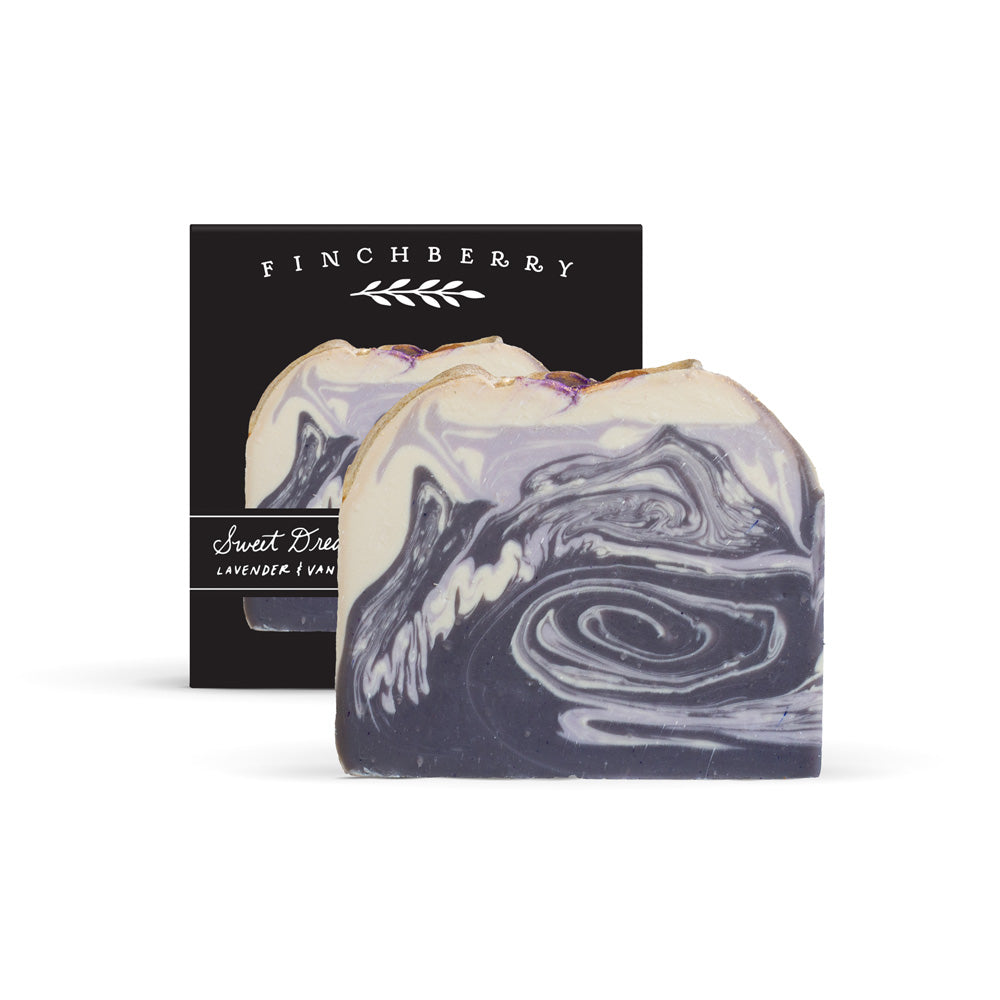 Marbled purple and white soap with Finchberry packaging in the background