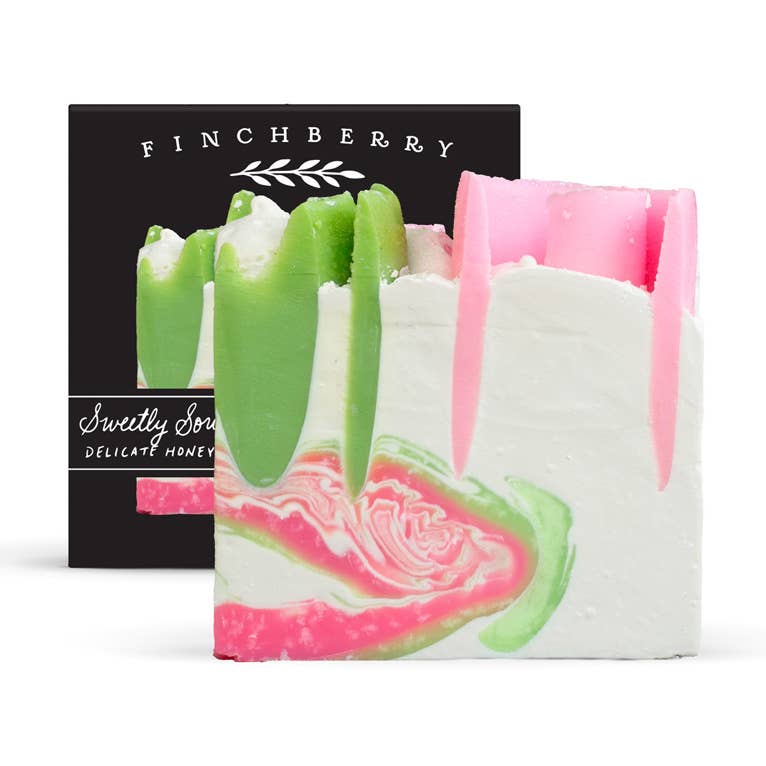 Colorful soap bars with a 'Finchberry' branded box in the background