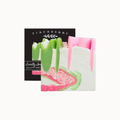 A square bar of soap with a white base and pink and green marbled swirls, shown in front of its black packaging box labeled FINCHBERRY.