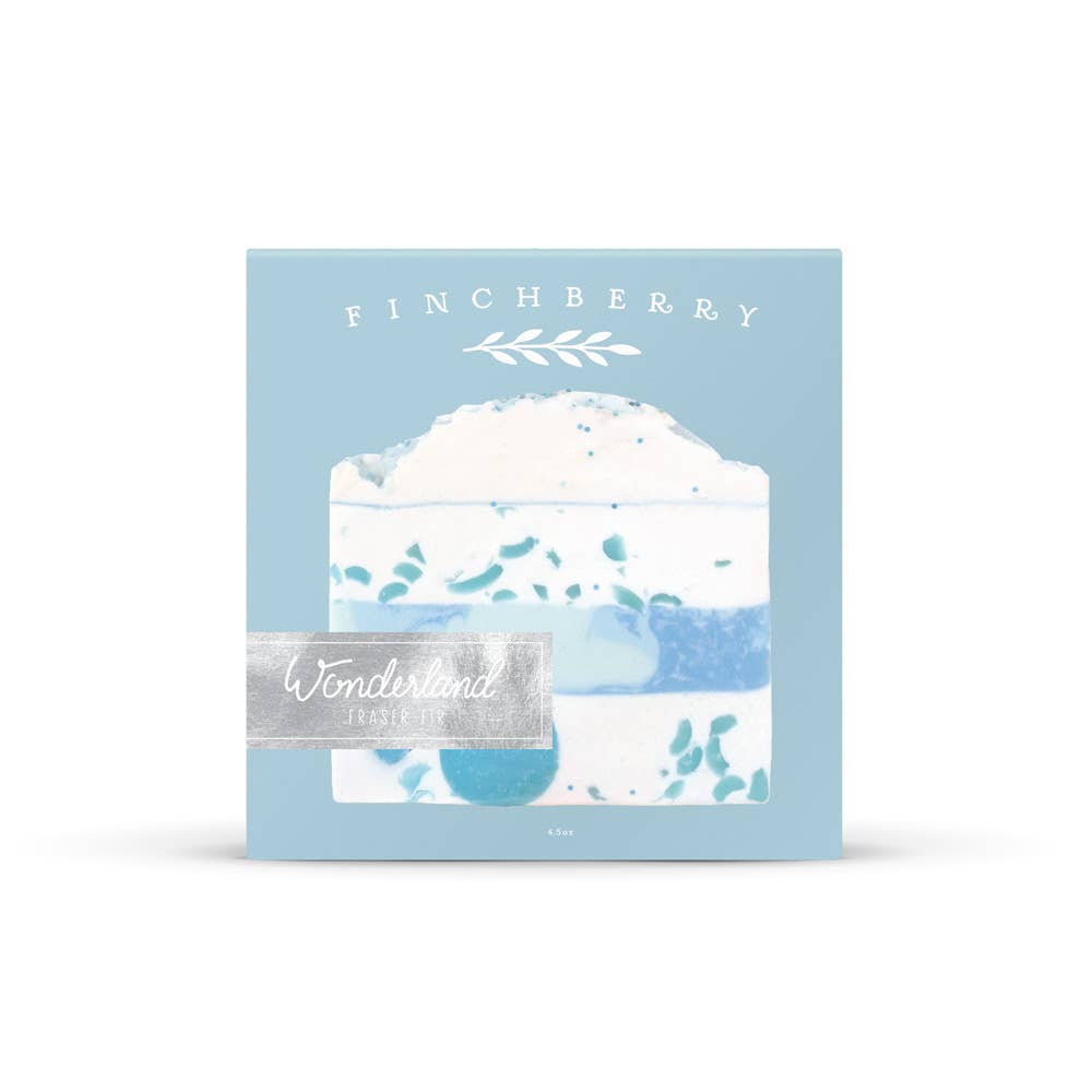 A square product box for Finchberry Wonderland Jelly Beans, featuring a light blue background with an illustration of a slice of cake and blue jelly bean graphics, set against a plain white background.