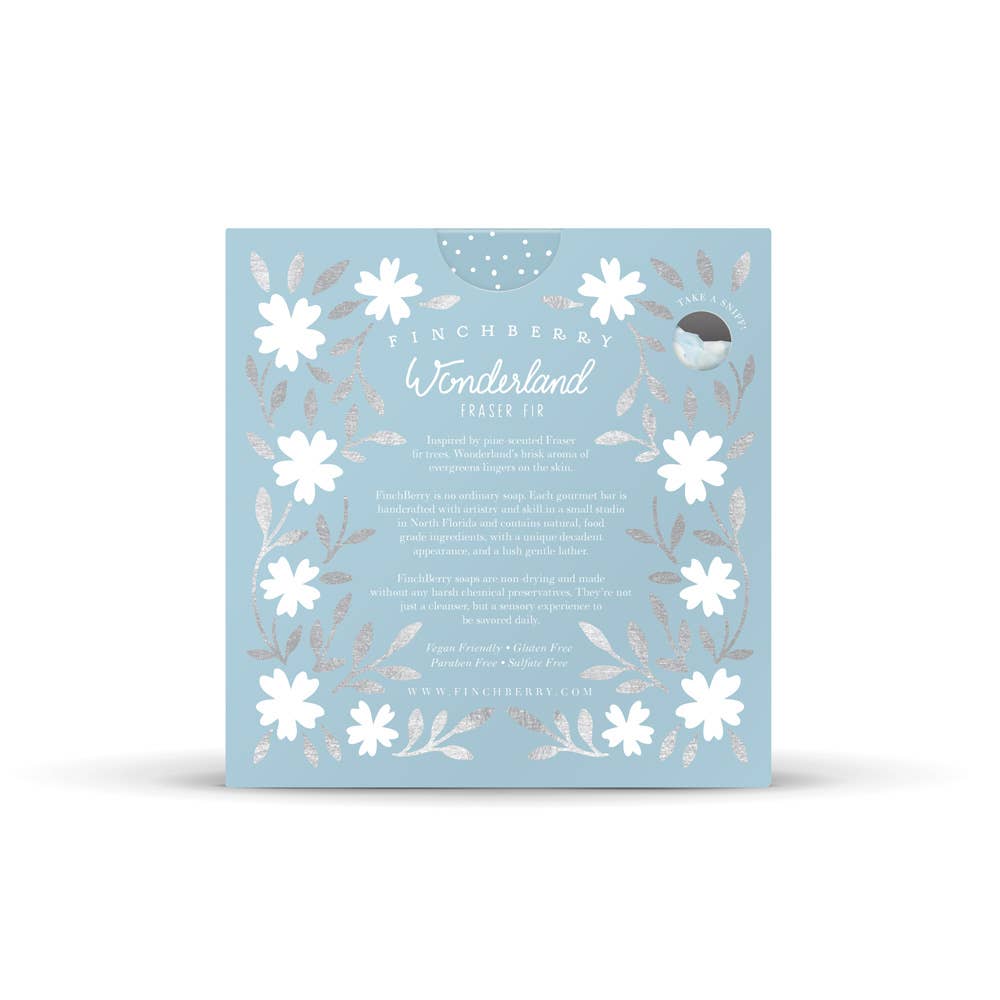 A square light blue card featuring white floral illustrations and silver-toned botanical accents, with the text 'Tinchberr» Wonderland Paper Pie' centered on a white background.