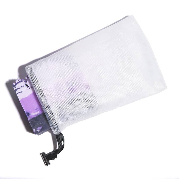 White mesh pouch with a purple item partially visible inside on a white background
