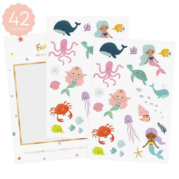 Sheet of mermaid and sea creature tattoos with a card on a white background