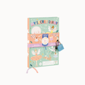 A children's 'My Secret Diary' featuring whimsical fairy and moon illustrations on a mint green cover, wrapped in a decorative paper band with a small blue padlock attached, shown on a plain white background.