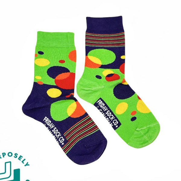 Colorful socks with polka dot pattern and 'Friday Sock Co.' branding on a white background.