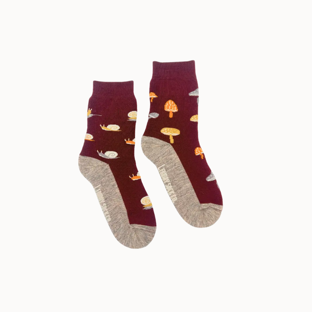 A pair of maroon socks with mushroom pattern on a white background