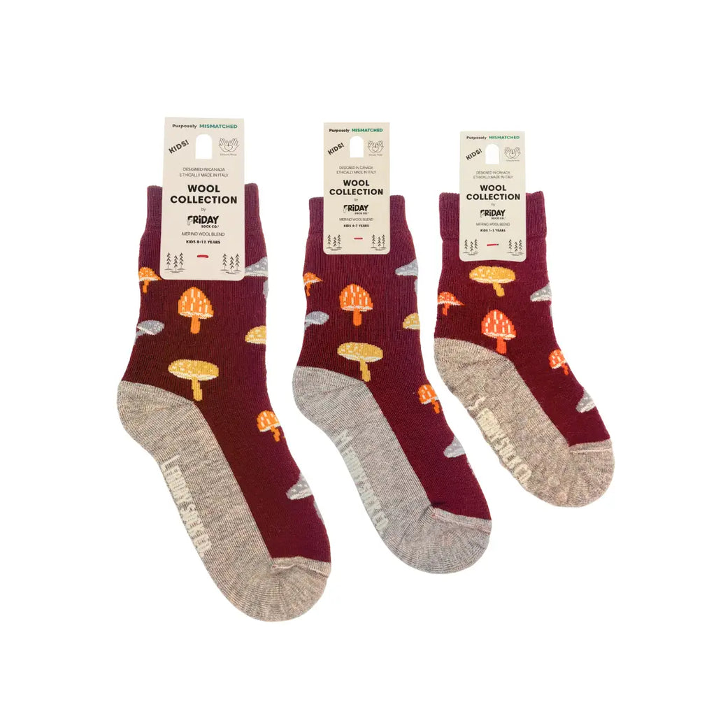 Three pairs of maroon socks with mushroom pattern on a white background