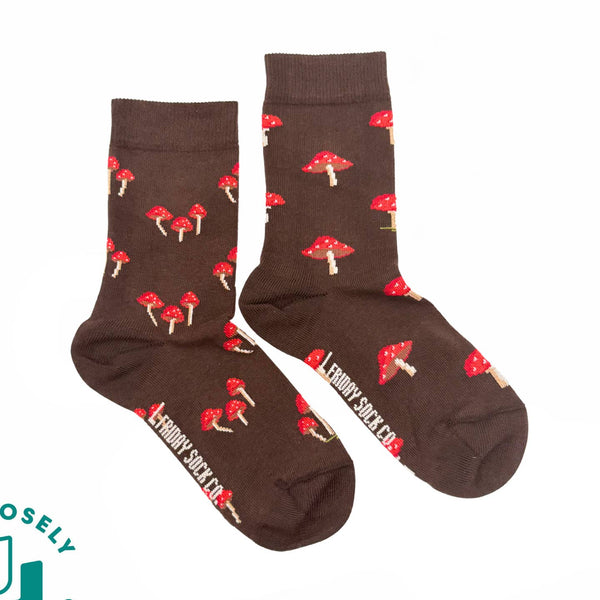 Brown socks with red mushroom pattern on a white background