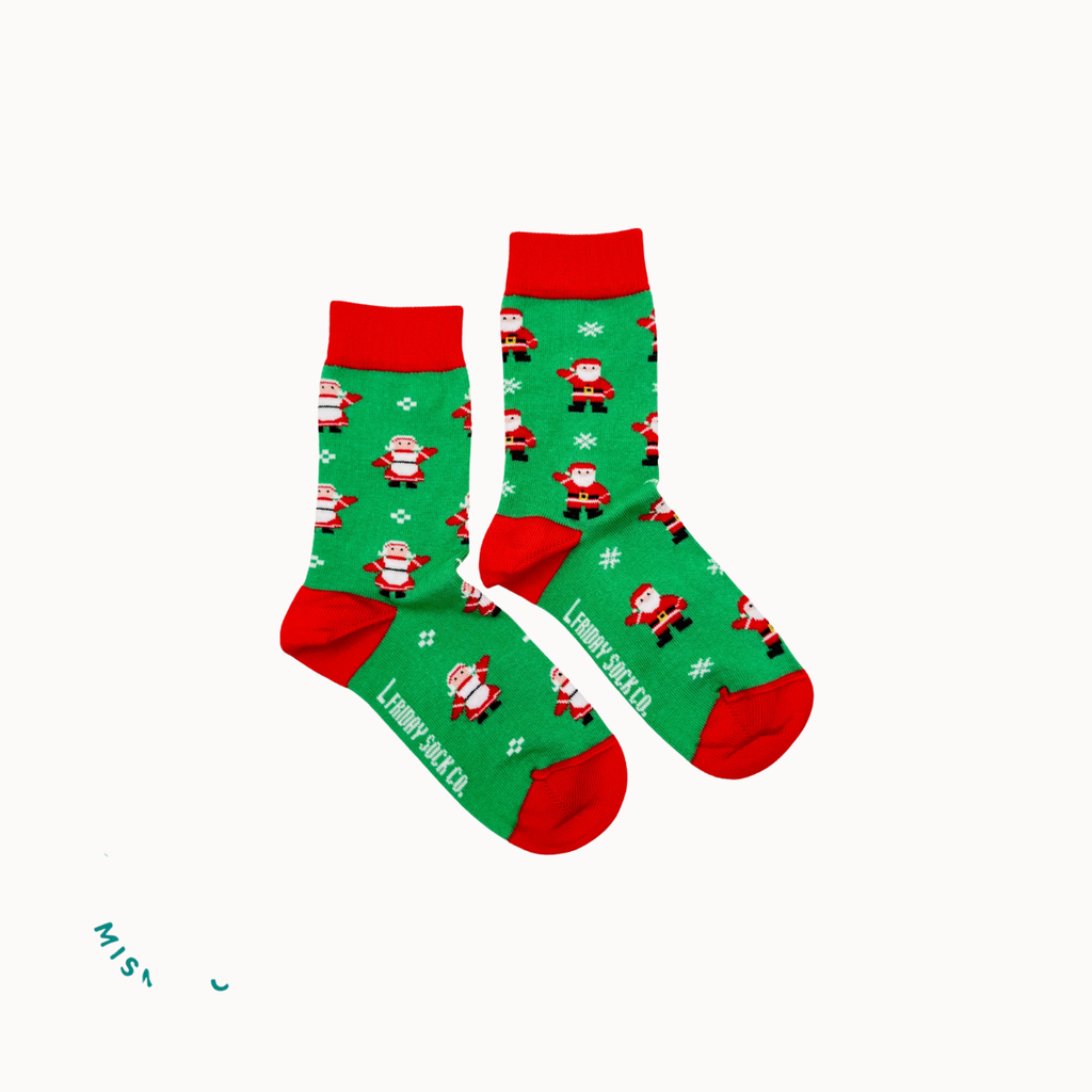 A pair of Christmas-themed crew socks displayed on a white background 
