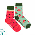 Two pairs of socks with watermelon pattern on a white background