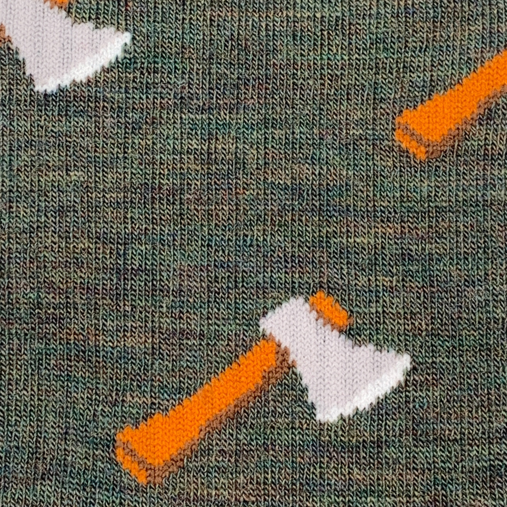 Pattern of axes on a textured green background