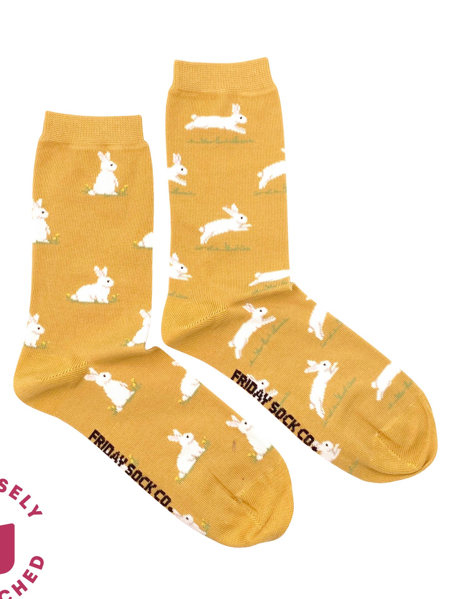yellow socks with bunnies on them on white background