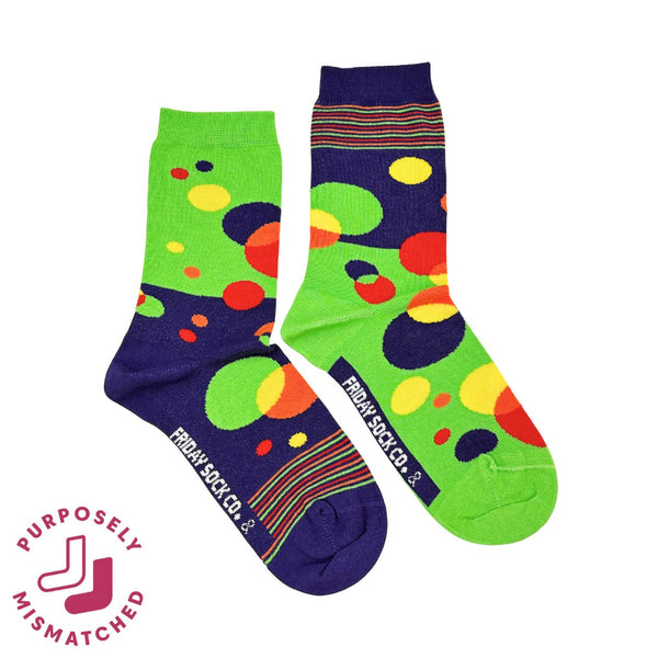 Two mismatched socks with colorful patterns on a white background, featuring the brand 'Friday Sock Co.'