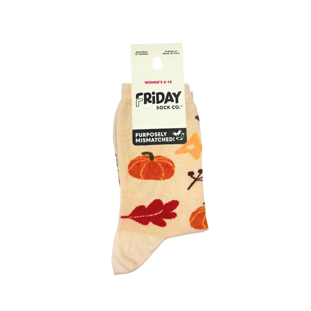 A single ankle sock from Friday Sock Co. featuring an autumn fall print with pumpkins, leaves, and branches on a cream background, shown with its paper header card.