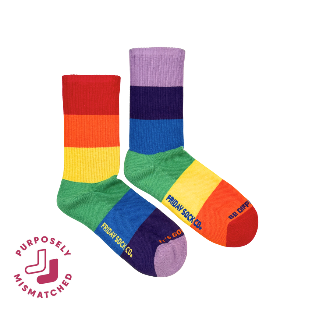 Colorful mismatched socks with rainbow pattern and 'Friday Sock Co.' branding on a white background.