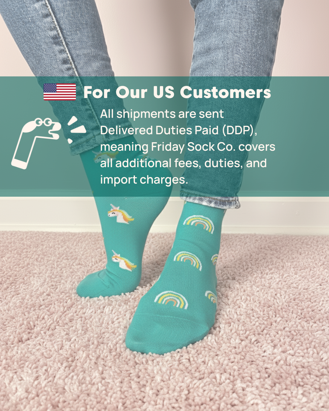 Person wearing teal socks with rainbow and unicorn designs, standing on a carpeted floor.