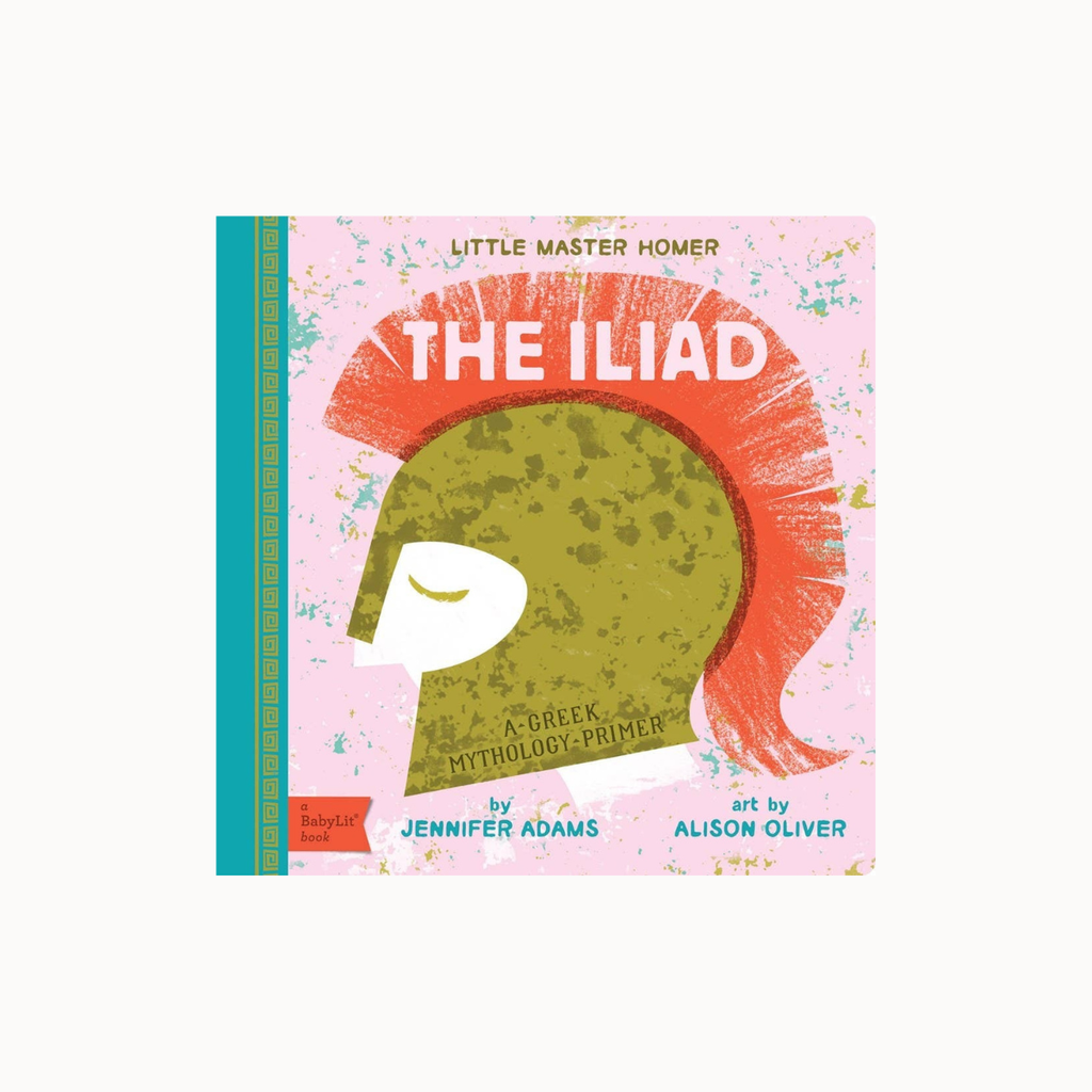 The Iliad children's book cover by Jennifer Adams, featuring a stylized Spartan helmet with a red-orange hair and a green face on a pink background. The book is shown standing upright with a teal spine band on a light gray background.