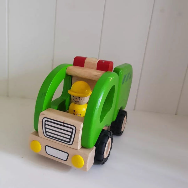 Wooden toy truck with a driver figure on a white background