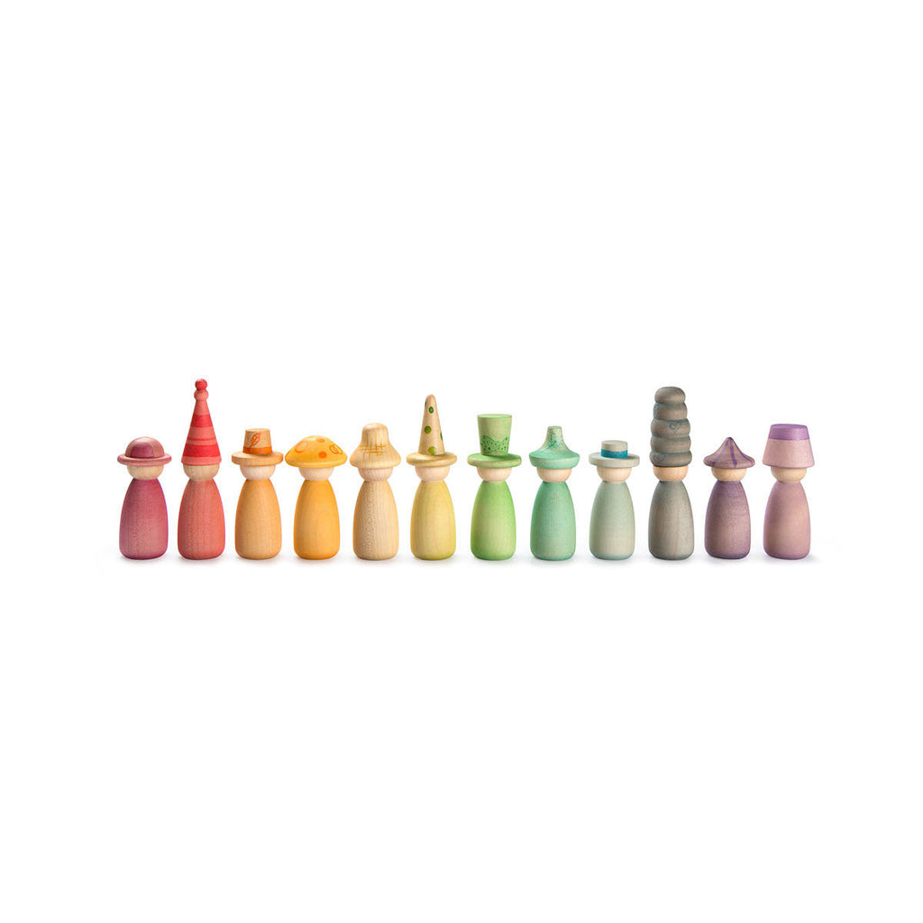 Set of colorful wooden pegs arranged in a row on a white background