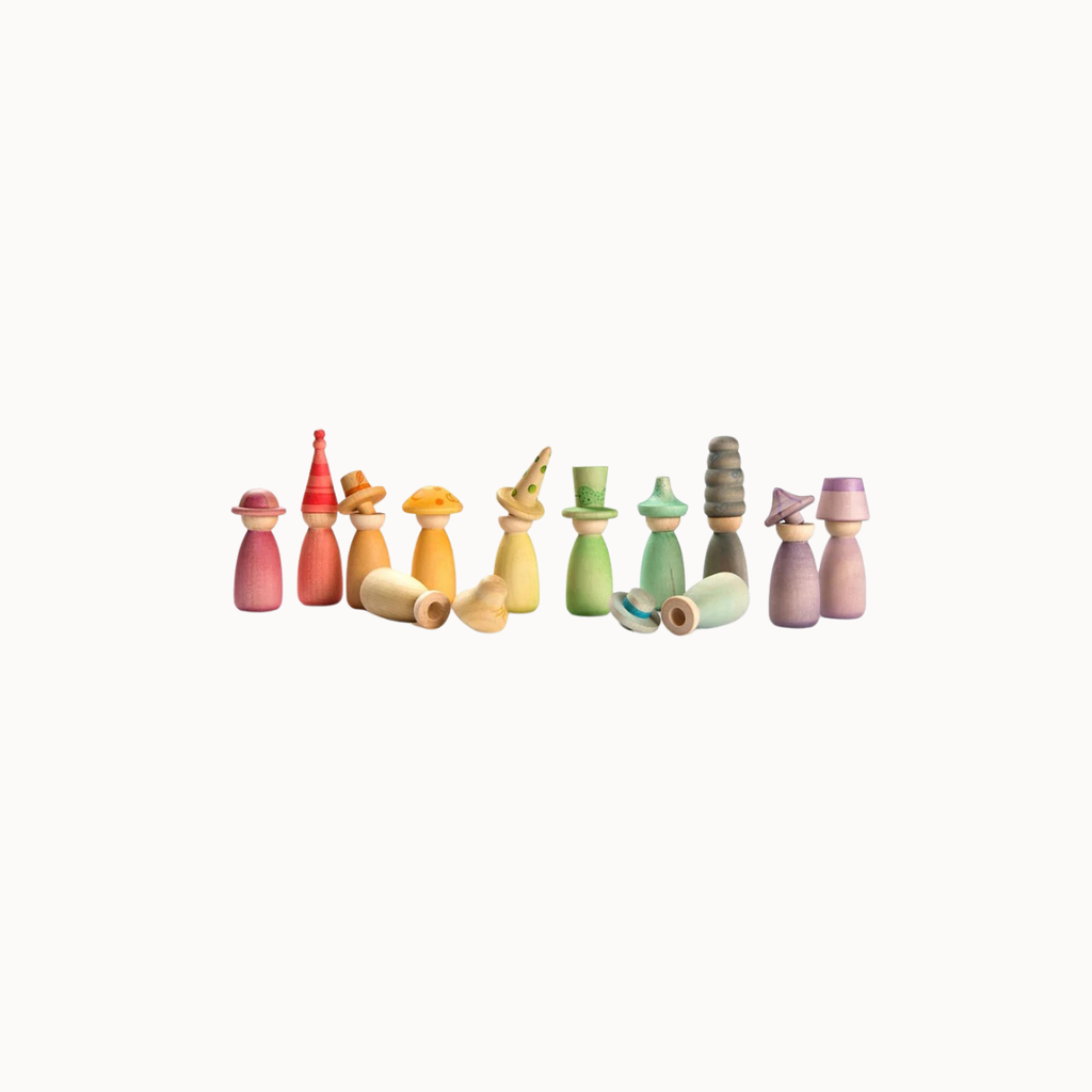 A set of small wooden toy figures with colorful painted bodies and assorted hats, arranged in a row on a plain white background.