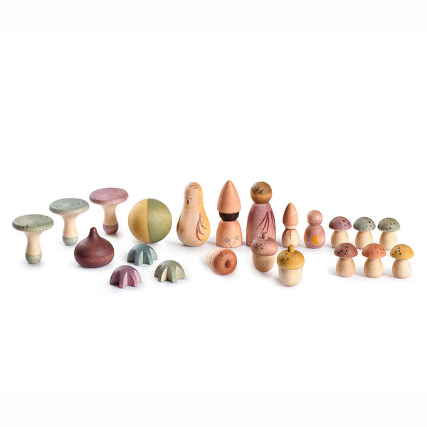 Set of colorful wooden mushroom-shaped toys on a white background