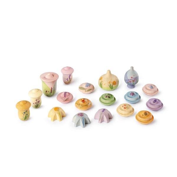 Set of small, colorful wooden toys on a white background
