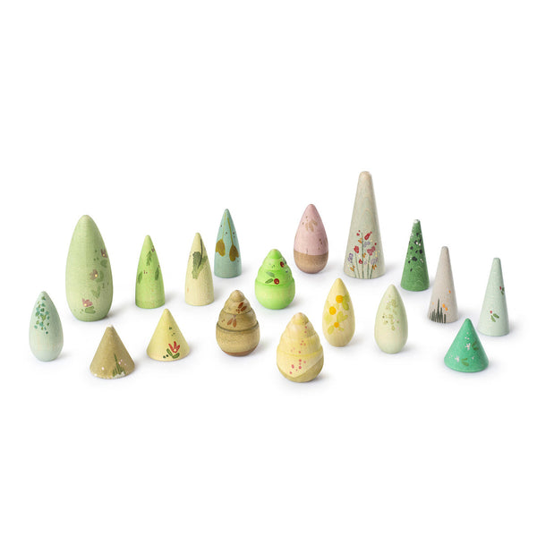 Set of small wooden trees with various designs on a white background
