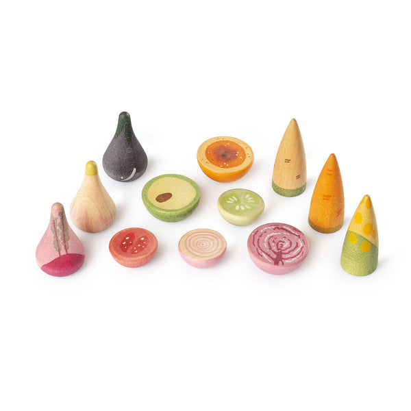 Set of colorful wooden toy fruits and vegetables on a white background