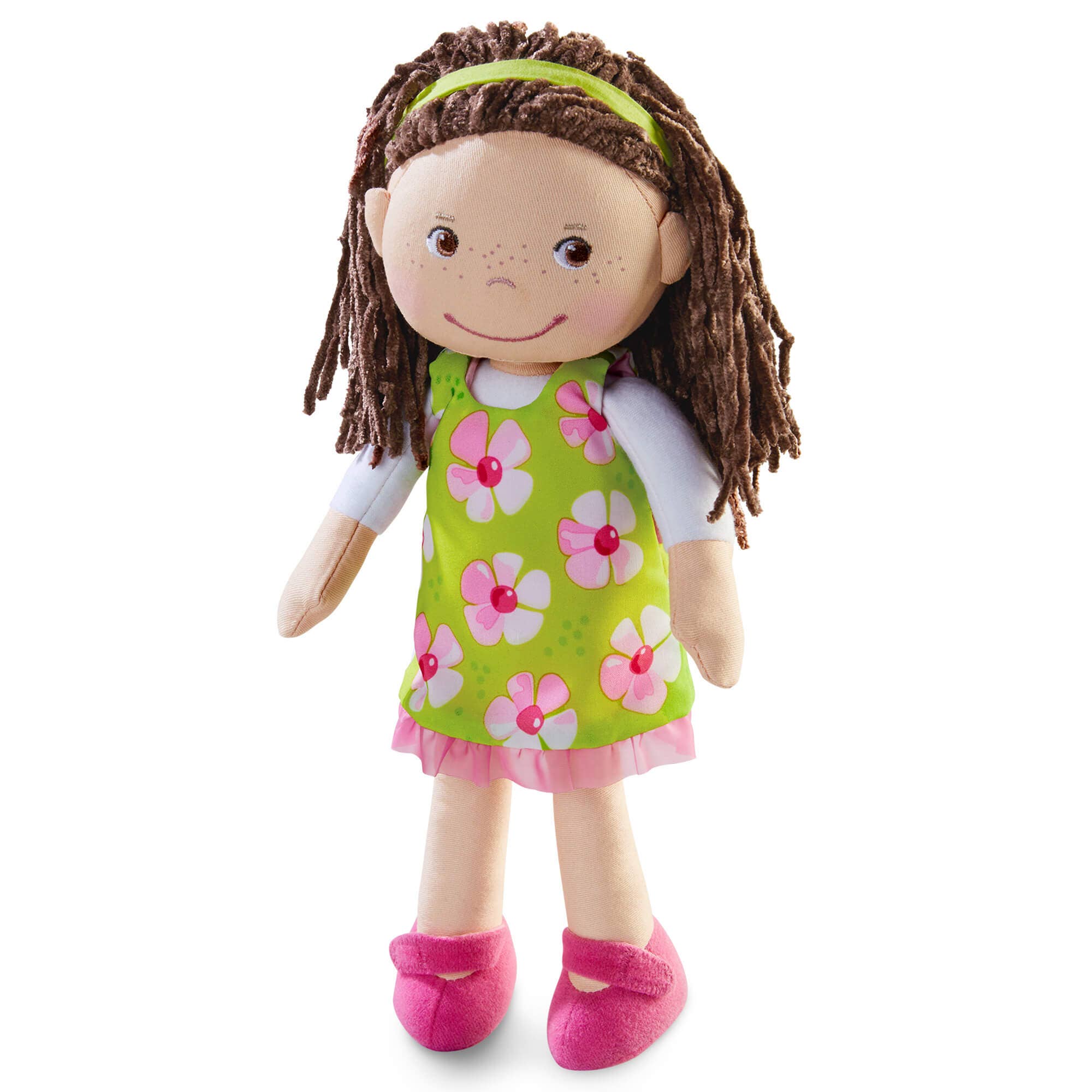 Plush doll with brown hair, green dress with pink flowers, and pink shoes on a white background