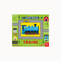 Children's activity book cover titled 'MAKE TRACKS TRAINS' by Johnny DeJonghiers, published by Busy Crow. The cover features a colorful cartoon illustration of a blue steam locomotive on a yellow track, surrounded by illustrated houses, barns, and trees on a bright green background.