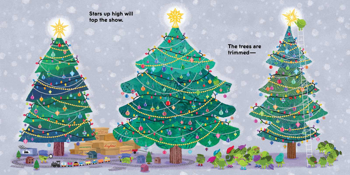 Three decorated Christmas trees with lights and stars on a snowy background