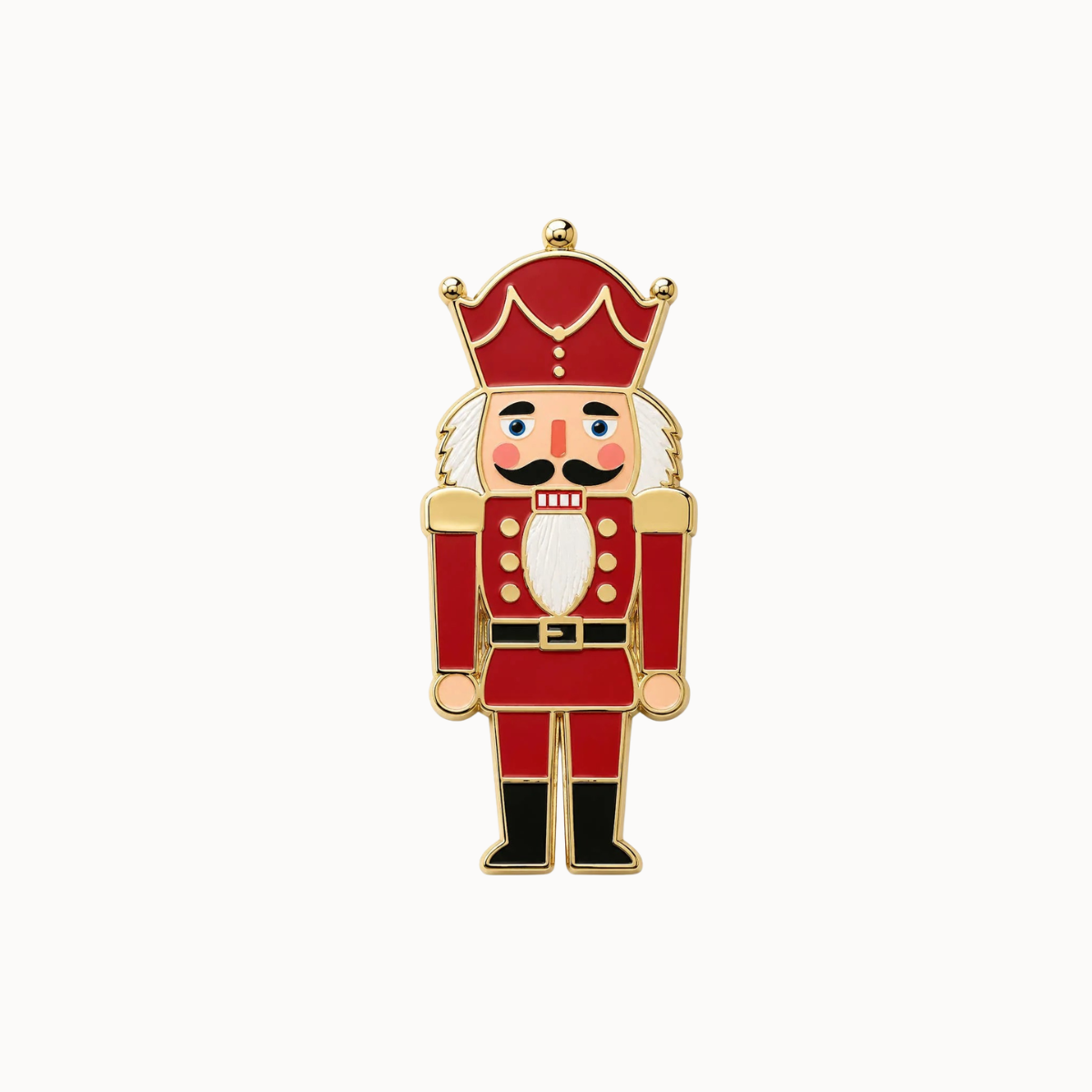 A nutcracker-shaped enamel pin with a red uniform, gold trim, white beard, and black boots on a plain white background.