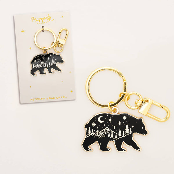 Black bear keychain with gold accents on a white background