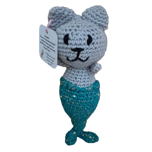 Crocheted mermaid cat toy with a teal sequin tail on a wooden surface