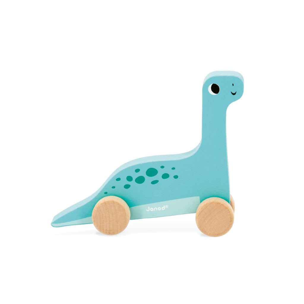 Toy dinosaur with wheels on a white background