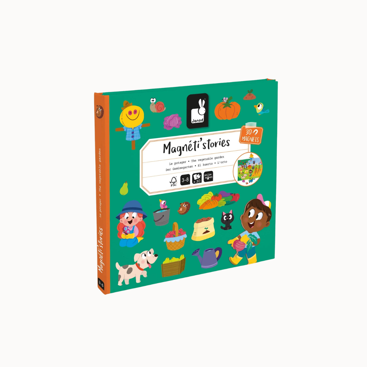 A children's activity book titled 'Magnéti stories' shown at a slight angle on a plain light background. The cover is predominantly teal green with colorful cartoon illustrations including a scarecrow, pumpkin, bird, fruit, basket, and animal characters.
