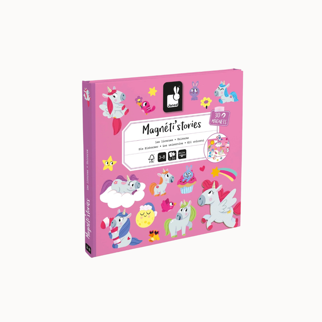 A pink children's activity book titled 'Magnéti stories' shown at a slight angle on a clean white background. The cover features colorful cartoon unicorn illustrations and small decorative graphics.