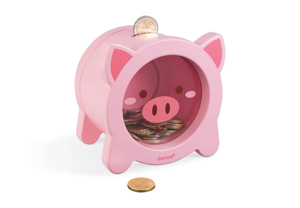 Pink piggy bank with coins inside on a white background