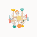 A wooden geometric baby toy with colorful painted circular pieces and a small penguin figure, shown on a plain light background.