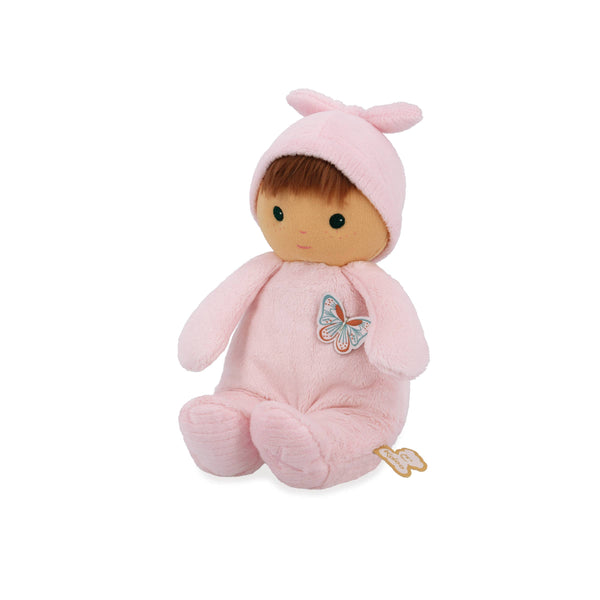 Plush toy baby doll in a pink outfit with a butterfly design on a white background