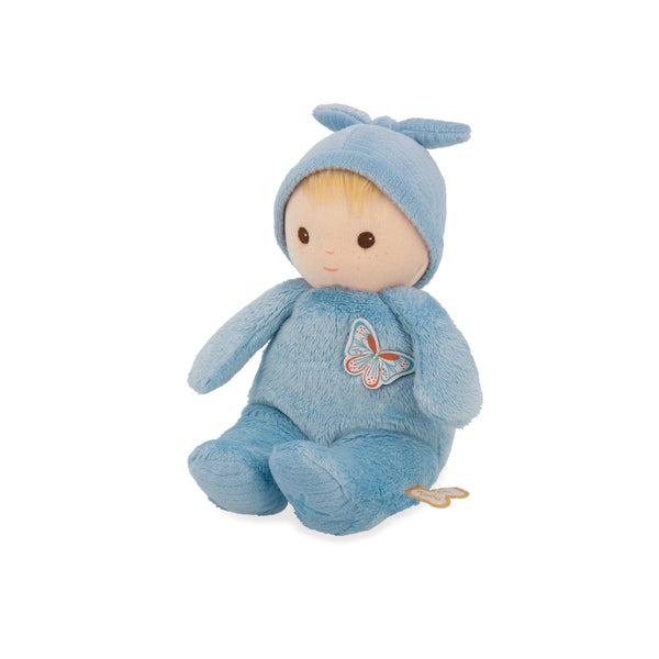 Stuffed toy in a blue outfit with a butterfly design on a white background