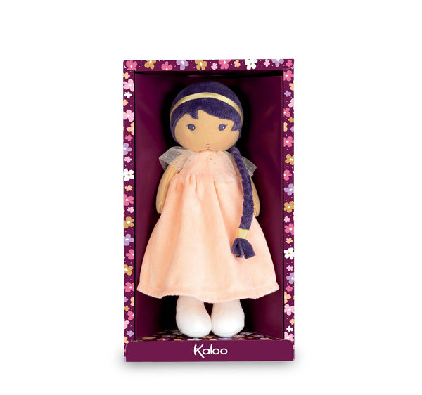 Plush doll in a pink dress with a purple headband in a decorative box, brand 'Kaloo' visible.