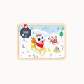 A rectangular wooden children's jigsaw puzzle featuring a winter scene with cartoon animals in sleds, shown completed on a light gray background. The puzzle has a light natural wood border and a printed illustration with blue snow, green trees, red clothing, and multicolored animal details.